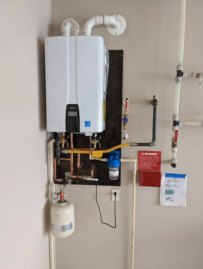 Professional plumber installing copper piping in a East Amwell home